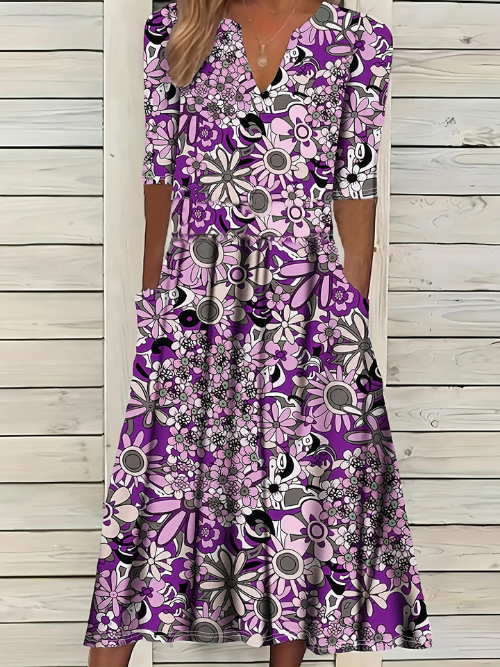 Odette | Midi-jurk met bloemenprint, V-hals en asymmetrische zoom
