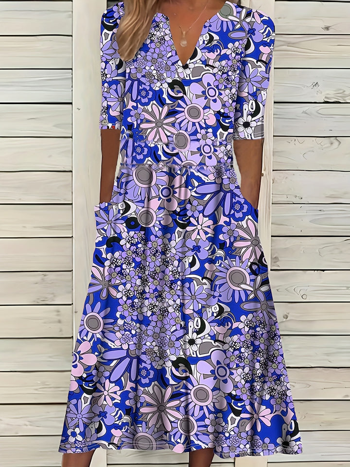 Odette | Midi-jurk met bloemenprint, V-hals en asymmetrische zoom